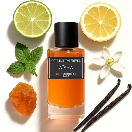 Der elegante Glasflakon des Aïsha Édition Intense Parfüms von Collection Privée, umgeben von frischer Zitrone, Minze, Orangenblüte, Bernstein und Vanilleschoten.