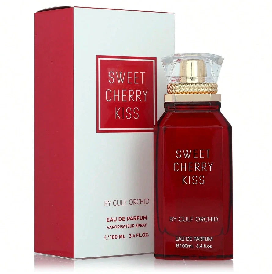 Das Gulf Orchid Sweet Cherry Kiss 100ml Unisex Parfum neben der dazugehörigen edlen Originalverpackung in Weiß mit markantem roten Inlay und Schriftzug.