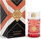 Das Gulf Orchid Sweet Heaven Cherry 100ml Unisex Parfum neben der dazugehörigen edlen Originalverpackung mit auffälligem geometrischem Muster in Rot, Schwarz und Gold.