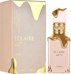 Das Lattafa Eclaire 100ml Damen Parfum neben der dazugehörigen rosa Originalverpackung mit dem markanten, schmelzenden Gold-Design.