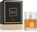 Das Lattafa Khamrah 100ml Unisex Parfum neben der dazugehörigen luxuriösen, schwarz-goldenen Originalverpackung.